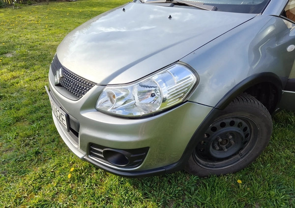 Suzuki SX4 cena 34500 przebieg: 135140, rok produkcji 2013 z Szczecinek małe 211